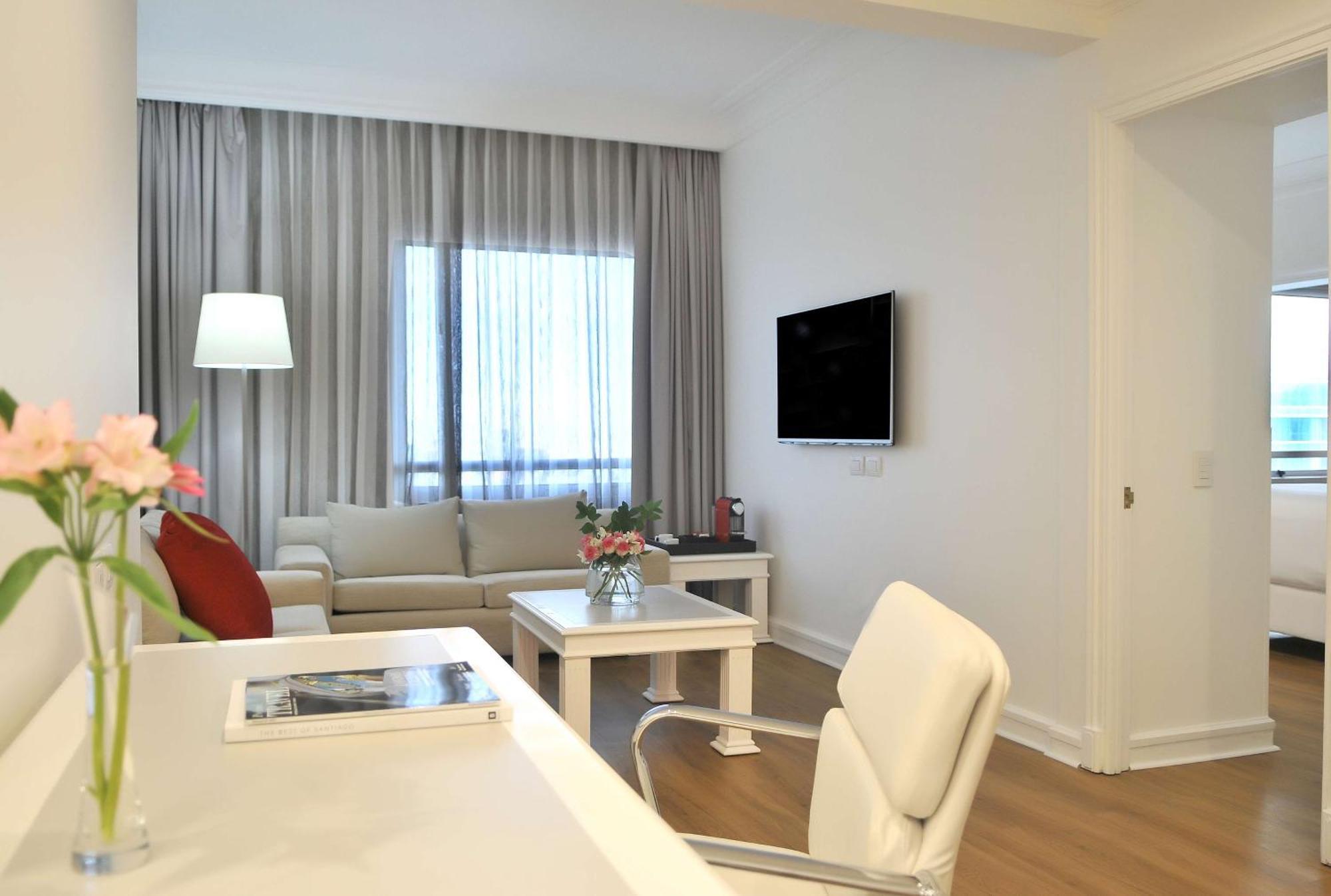 Nh Collection Plaza Santiago Hotell Exteriör bild A living room in a serviced apartment in Athens, Greece